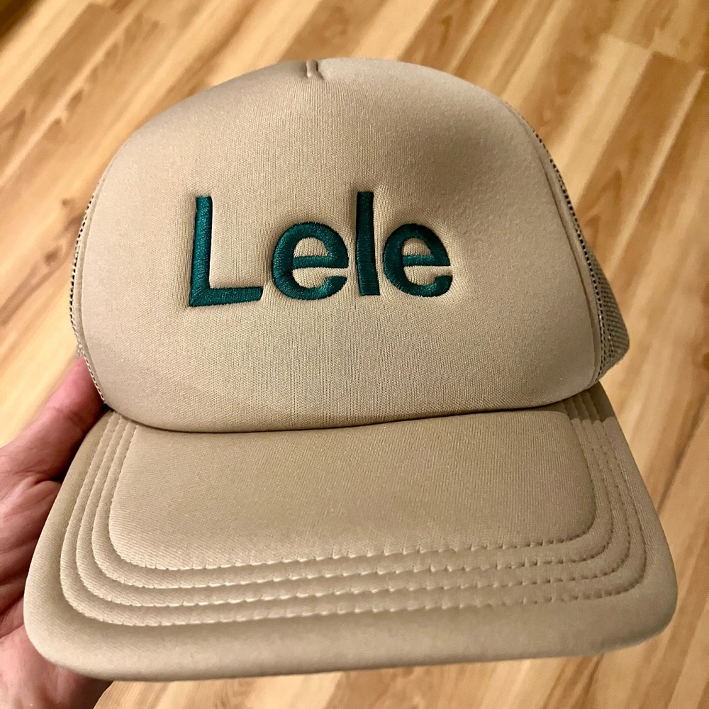 “Lele” Hawaiian Word Lids Tan Trucker Hat with Green Embroidery